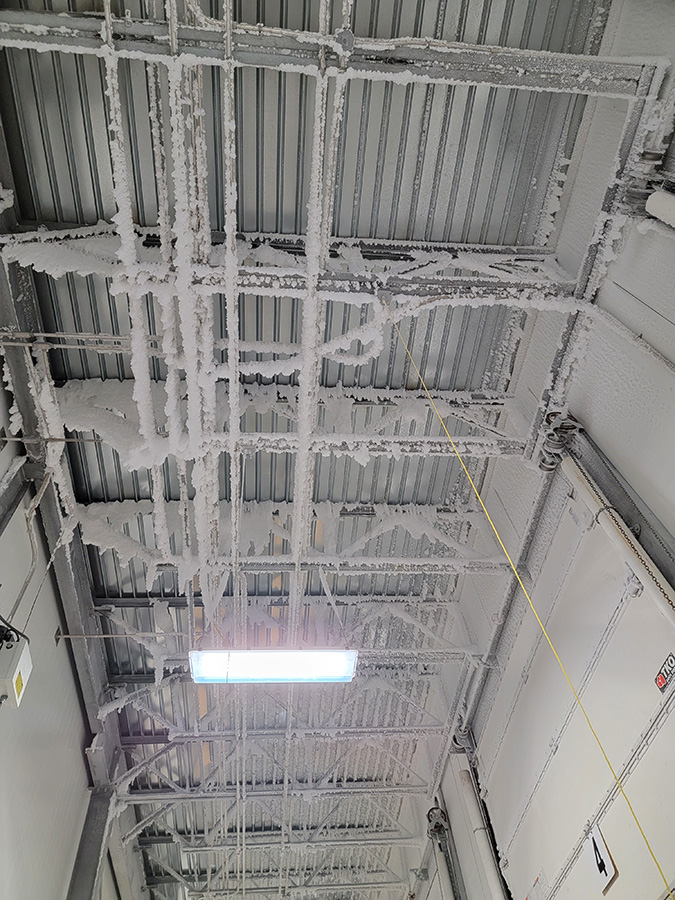 Ice formation on the underside of the roof deck.