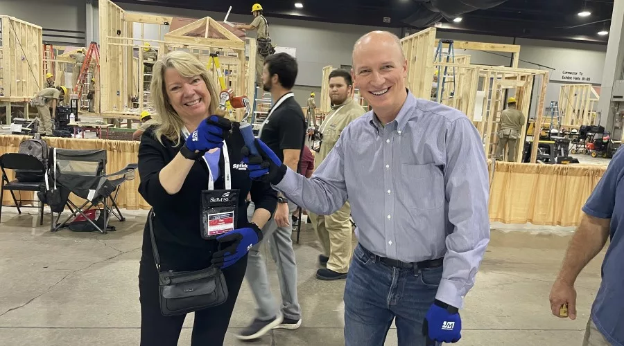 NRCA Chairwoman Lisa Sprick and CEO McKay Daniels celebrate their thermoplastic welding skills (2).jpg