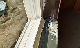 Self-adhered membrane turning into the rough opening to tie in with the interior air seal.