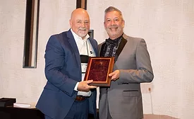 Rick Montoya Accpeting an Award from SPRI