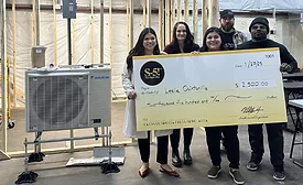 Leslie Quintanilla holds the $2,500 check. Also pictured are staff members, with S-5!’s Partner Development Manager, Kim Reichert.