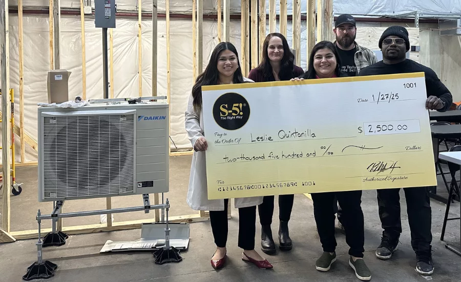 Leslie Quintanilla holds the $2,500 check. Also pictured are staff members, with S-5!’s Partner Development Manager, Kim Reichert.
