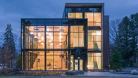 The outside of Roux College at night