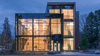 The outside of Roux College at night