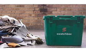 swatches in a pile outside of a Swatchbox