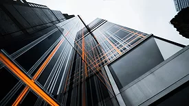 low-angle-photo-of-high-rise-buildings-under-white-sky