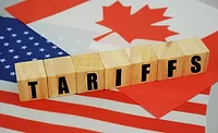 the word tariffs with a canadian and american flag