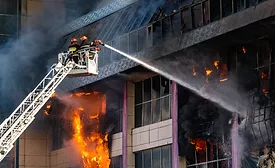 firefighters putting out a fire in a building