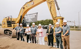 Georgia-Pacific crew wears hardhats while they break ground on new facility