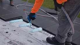 installing roof tile adhesives for commercial buildings