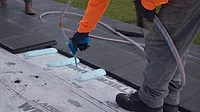 installing roof tile adhesives for commercial buildings