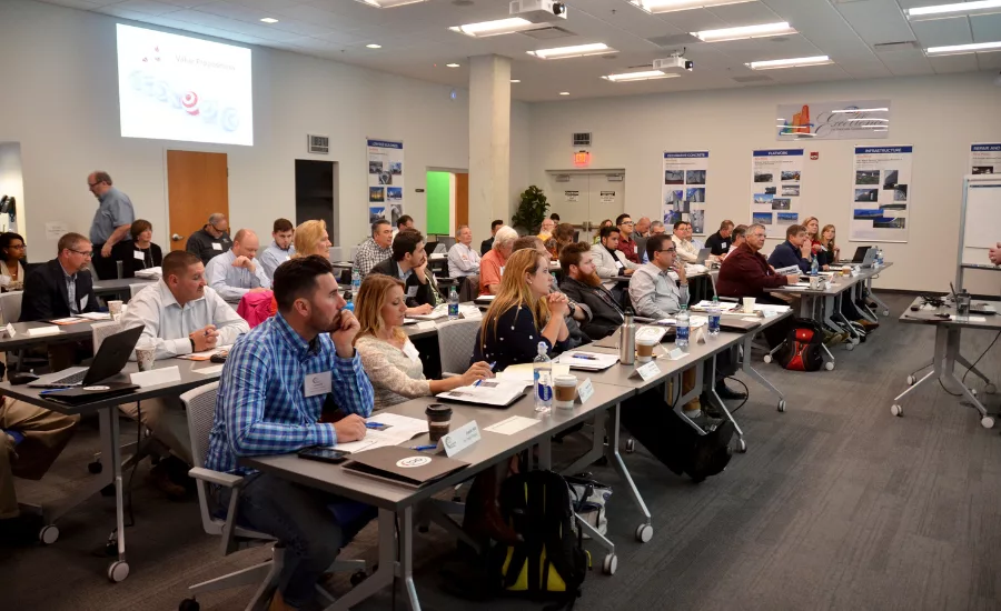 Attendees sit through ACI seminar