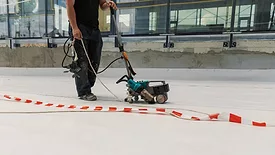 robot welder sealing tape on a roof