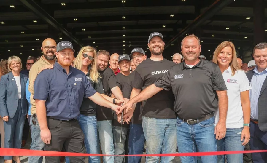 Central States employees pose for cutting of the grand opening ribbon