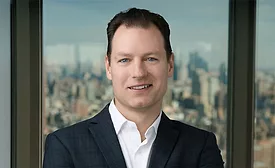 Picture of Erik Verboon, senior principal at Walter P Moore, wearing a dark suit jacket and white shirt. 