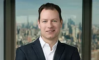 Picture of Erik Verboon, senior principal at Walter P Moore, wearing a dark suit jacket and white shirt. 