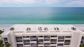 Roofing with the ocean in the background