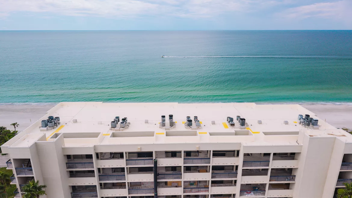 Roofing with the ocean in the background