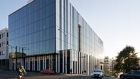 Cascadian façade with a striking aesthetic of alternating vertical spandrel and vision glass