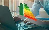 man types at computer with home energy levels