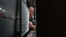 pro looking at HVAC unit