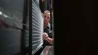 pro looking at HVAC unit