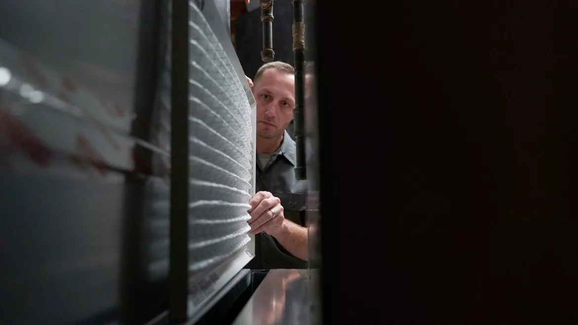 pro looking at HVAC unit