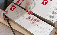 ROCKWOOL Smartrock in a pile with a glove on top