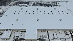 high-resolution aerial shot of a snowy roof thermal bridging