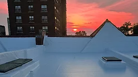 A completed high-performance enclosure (Gerhardt Apartments, St. Louis). sun sets in the background