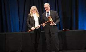2026 PCI Chair Cheryl Lang receives the ceremonial gavel from outgoing 2025 PCI Chair Carlos Cerna.