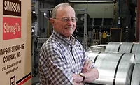 Barc Simpson stands in front of Simpson Strong-Tie facility