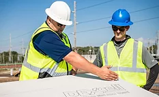 DEXcell for National Gypsum Company 2 construction workers and a DEXcell panel