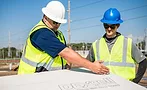 2 construction workers and a DEXcell panel