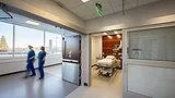 Patient room doors with flexible privacy features widens possible uses within these spaces and improves patient comfort