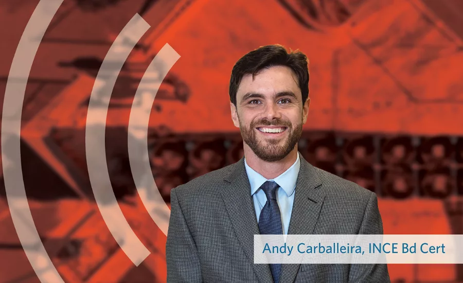 Andy Carballeira headshot behind an orange background
