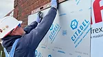 Worker on New Western Facade.jpg