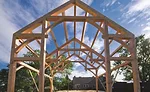 A timber frame awaiting SIPs installation.