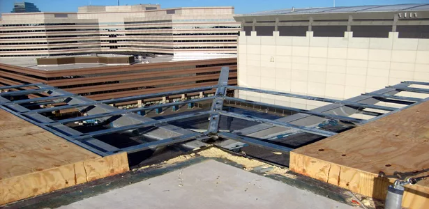 Transition detailing for the continuity of the air and vapor barrier system at the roof overhangs.